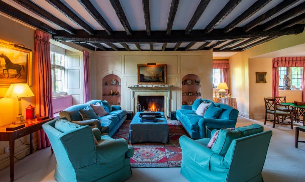 a living room filled with furniture and a fire place