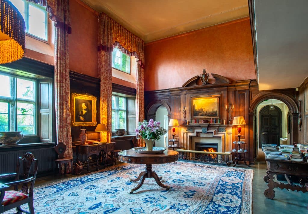 a living room filled with furniture and a fire place