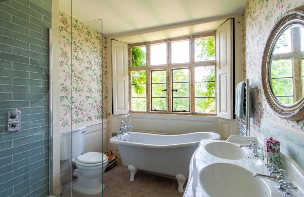 a large tub next to a window