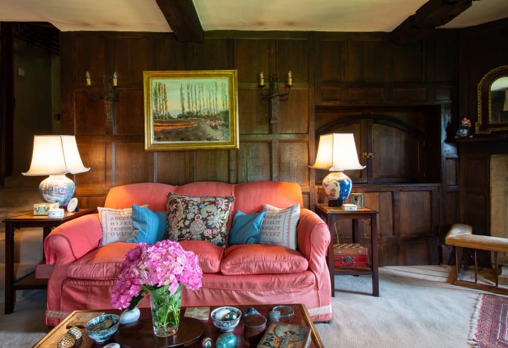 a living room filled with furniture and a fire place