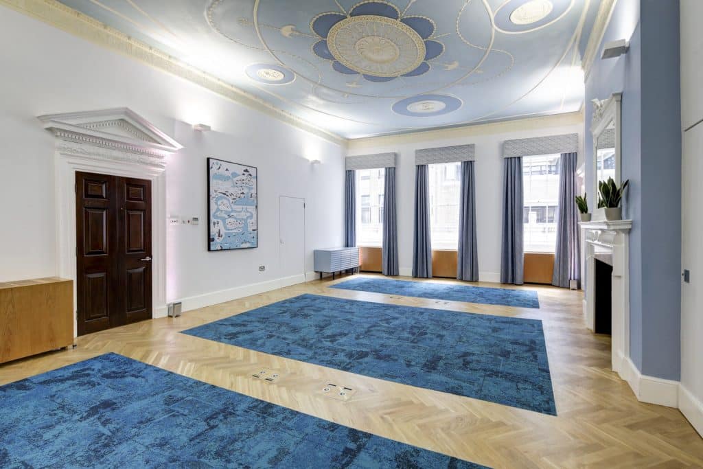 a room filled with furniture and a large window