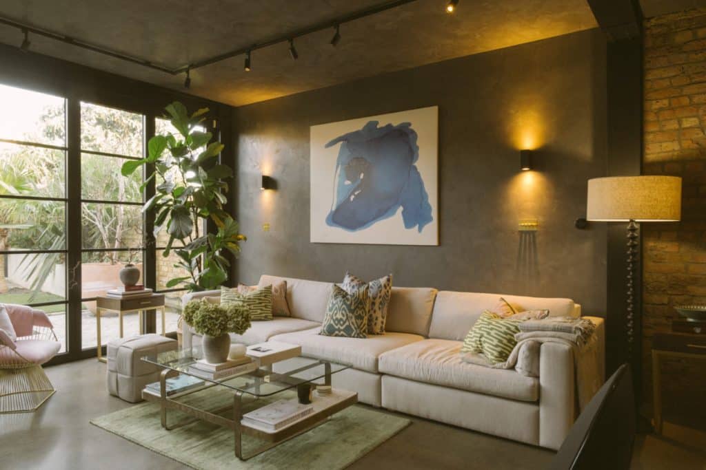 a living room filled with furniture and a large window