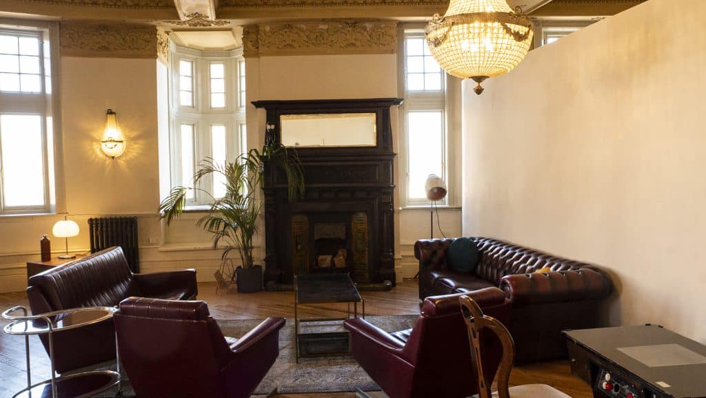 a living room filled with furniture and a fire place