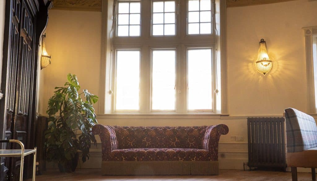 a living room filled with furniture and a large window