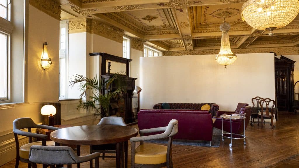 a living room filled with furniture and a large window