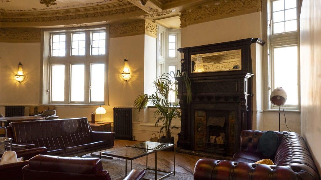 a living room filled with furniture and a fire place