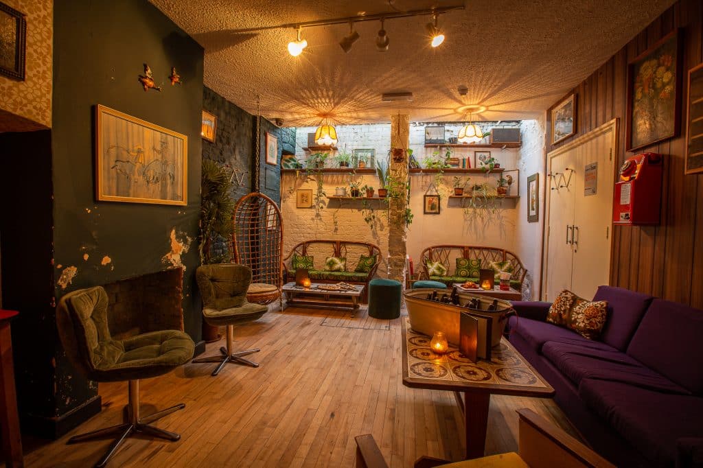 a living room filled with furniture and a fire place