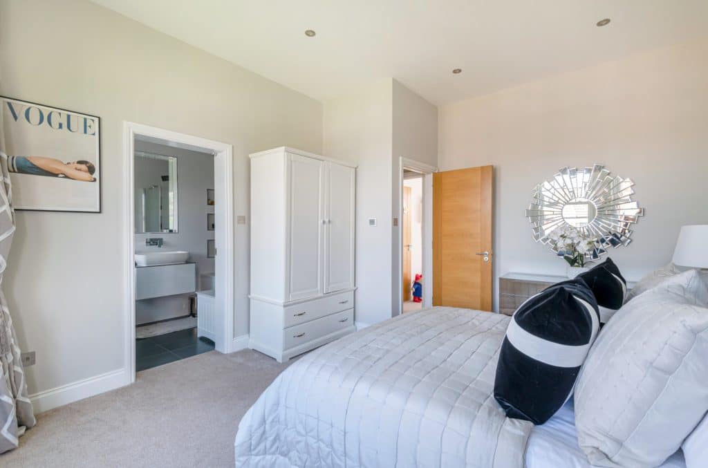 a bedroom with a bed in a room