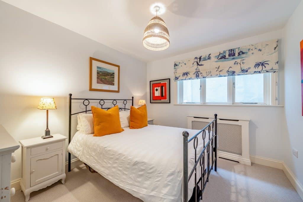 a bedroom with a bed in a room