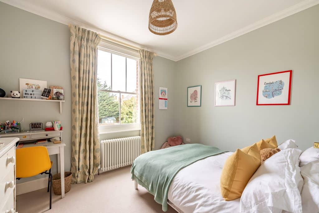 a bedroom with a bed in a room