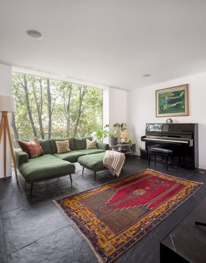 a living room filled with furniture and a flat screen tv