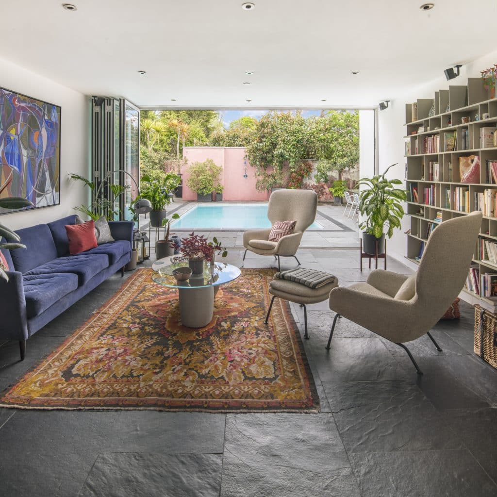 a living room filled with furniture and a rug