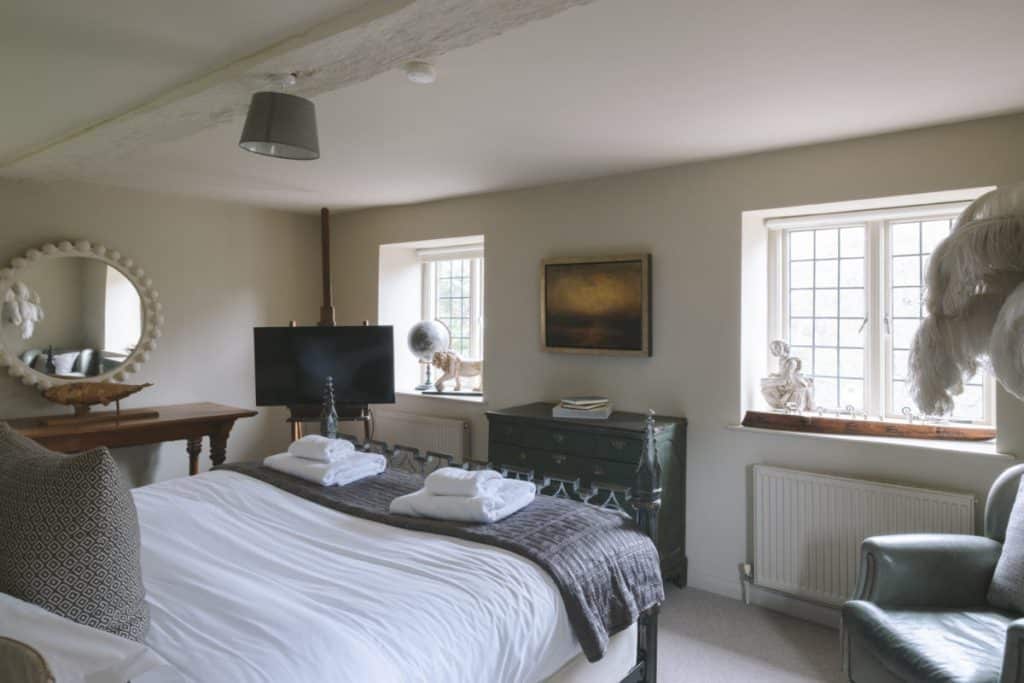 a bedroom with a large bed in a hotel room