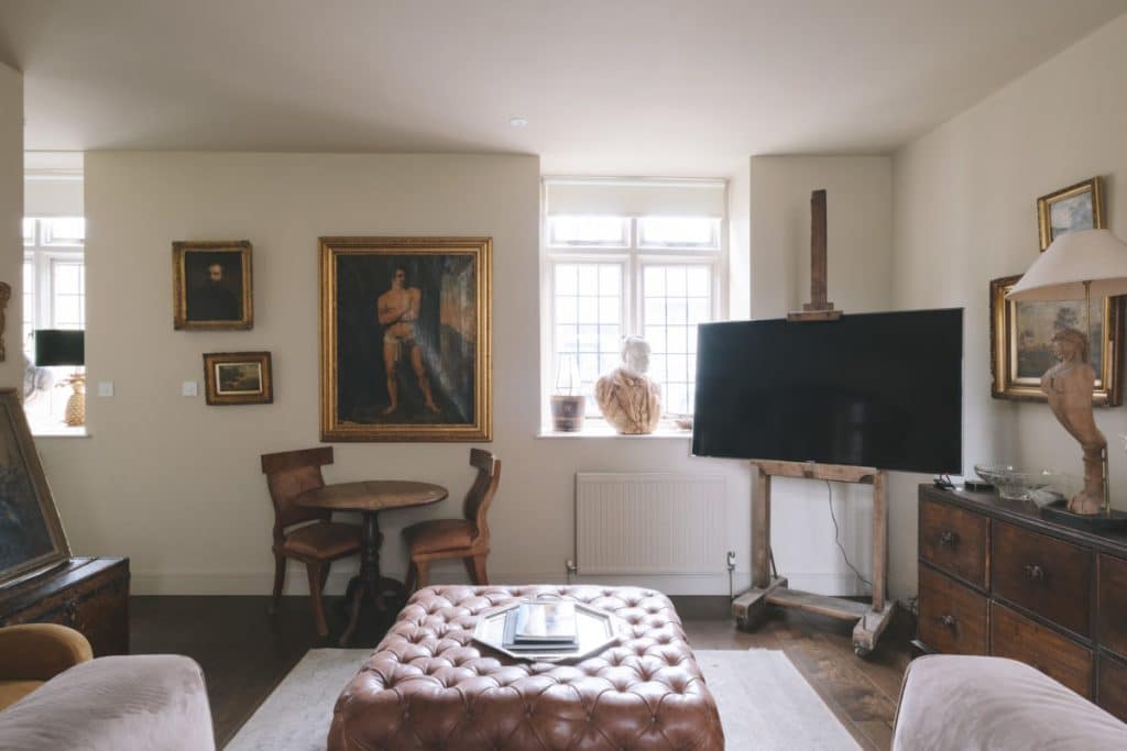 a living room filled with furniture and a fireplace