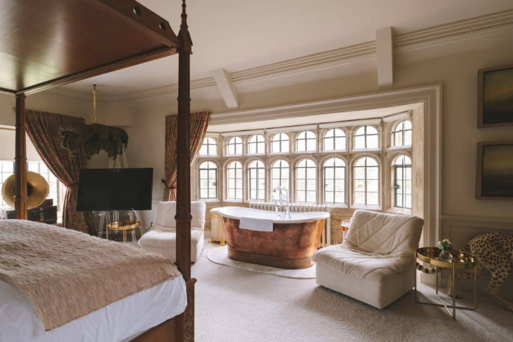 a bedroom with a large bed in a hotel room