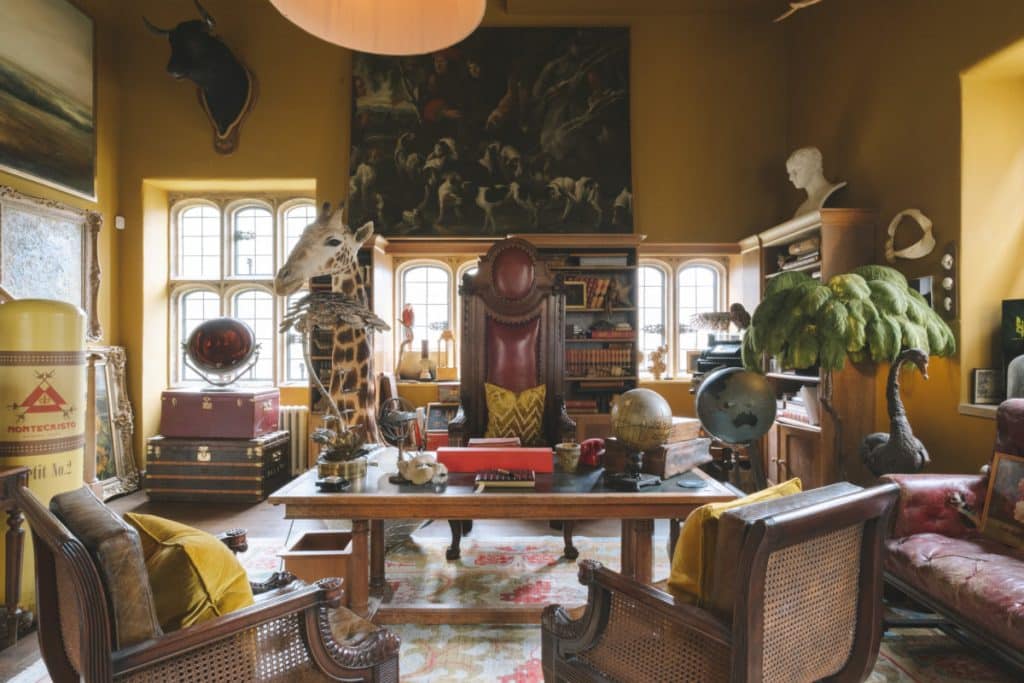 a living room filled with furniture and vase on a table
