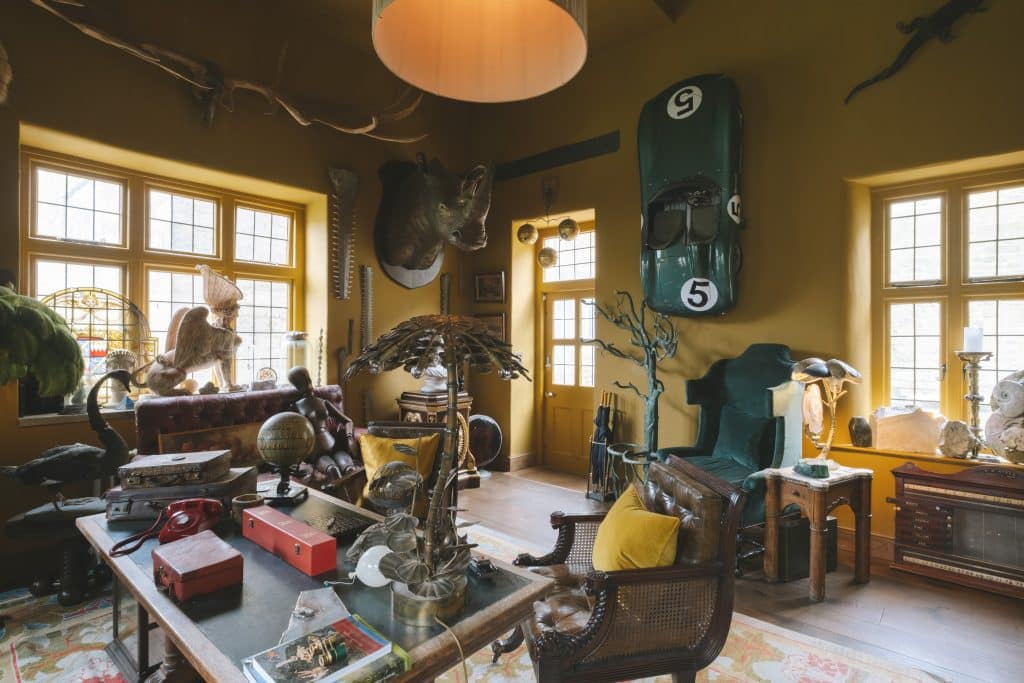 a living room filled with furniture and a large window