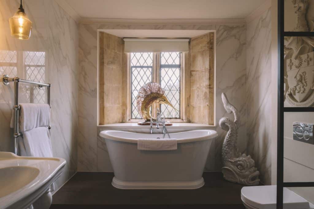 a large tub next to a sink