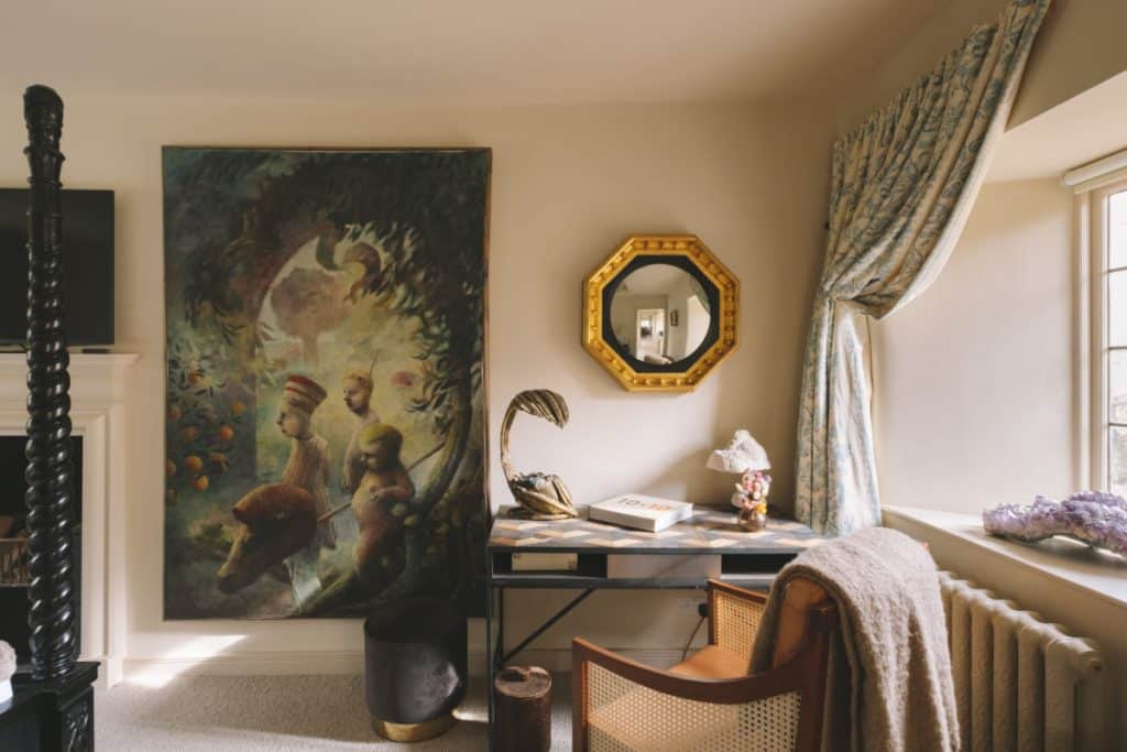 a bedroom with a bed and desk in a room