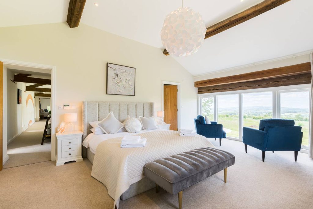 a bedroom with a large bed in a room