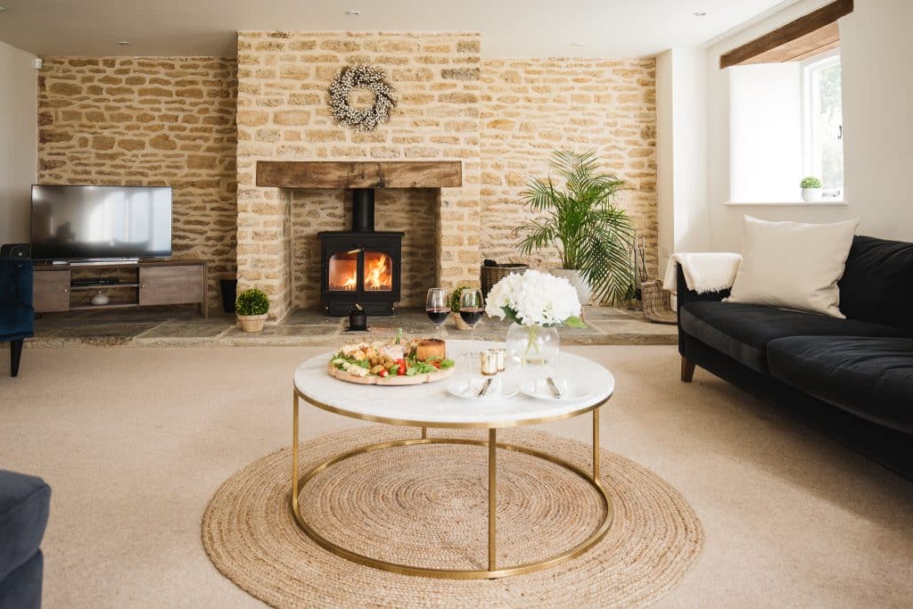 a living room filled with furniture and a fireplace