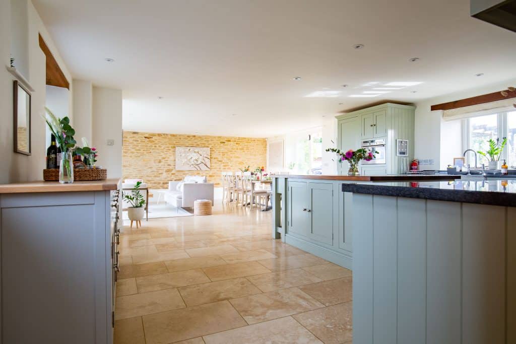 a kitchen with an island in the middle of a room