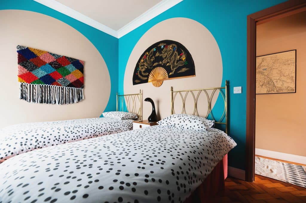 a bedroom with a bed in a room