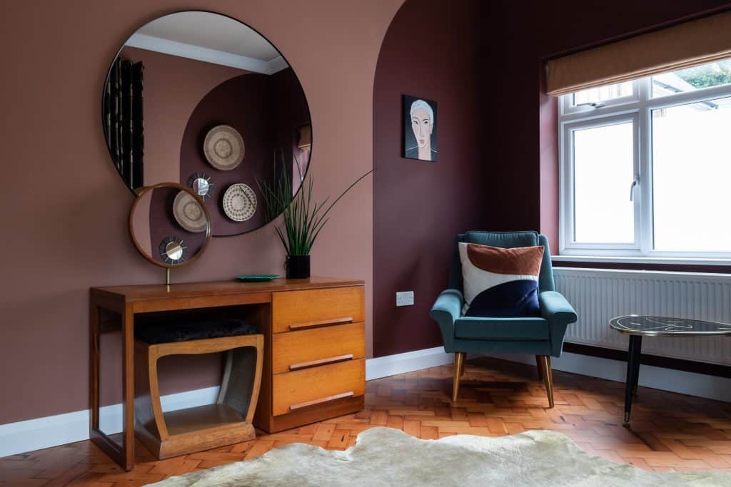 a living room filled with furniture and a large window