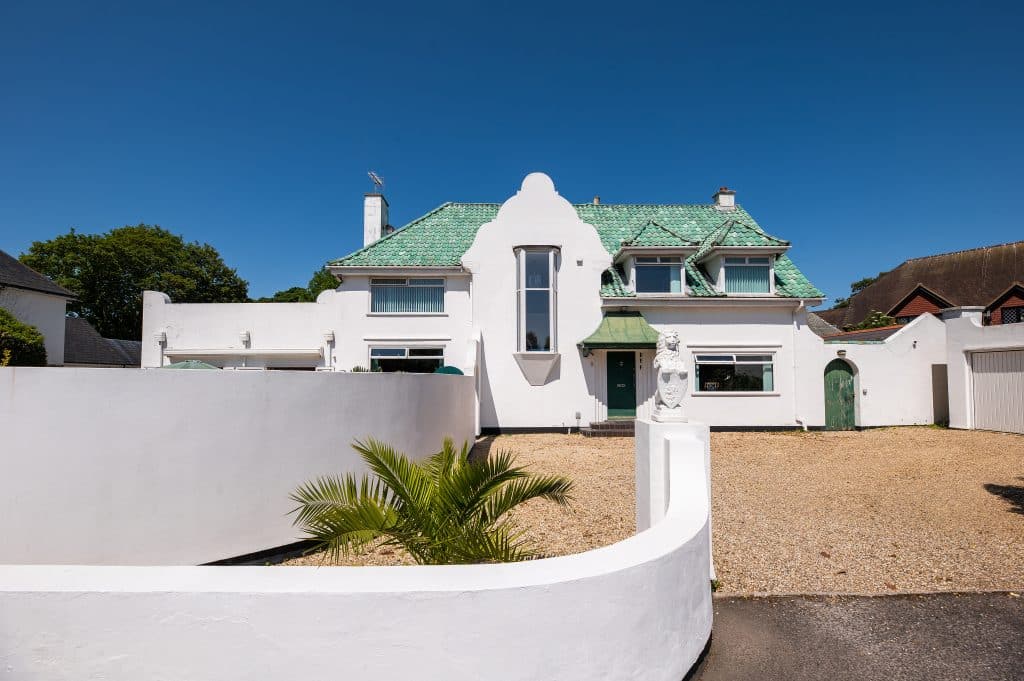 a house with trees in the background
