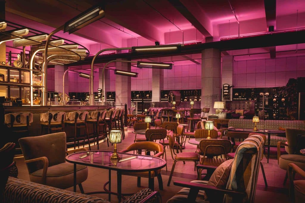 a room filled with furniture and a table in a restaurant
