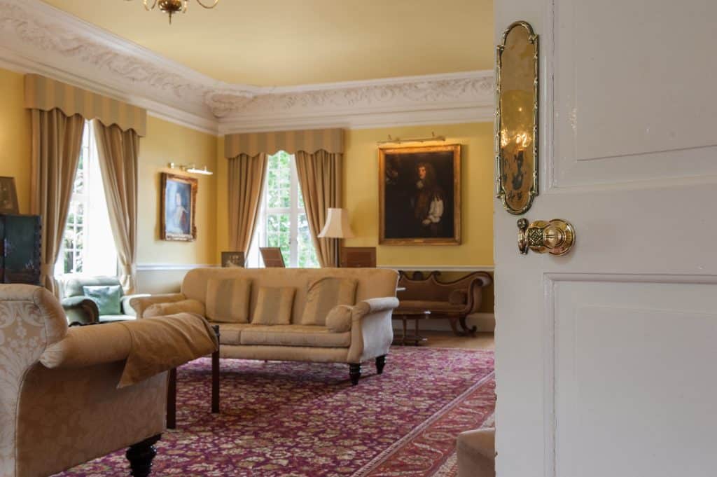 a living room filled with furniture and a large window