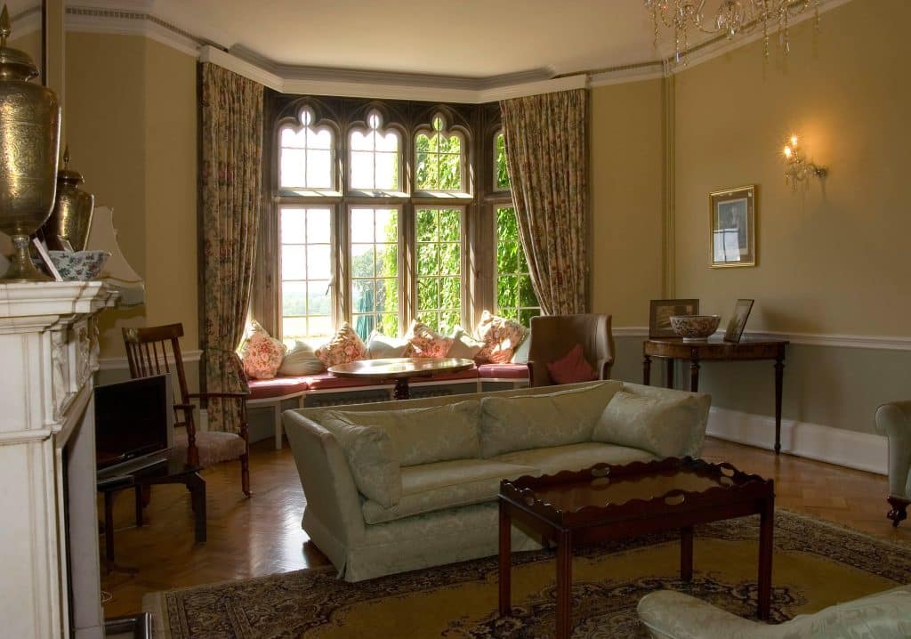 a living room filled with furniture and a large window