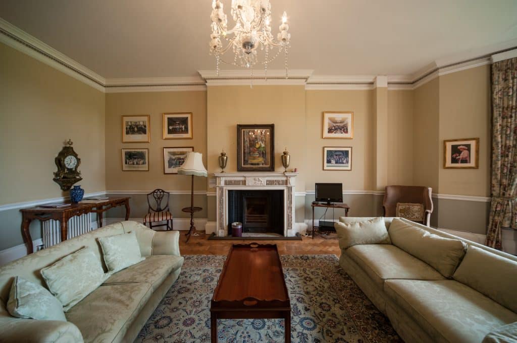 a living room filled with furniture and a flat screen tv
