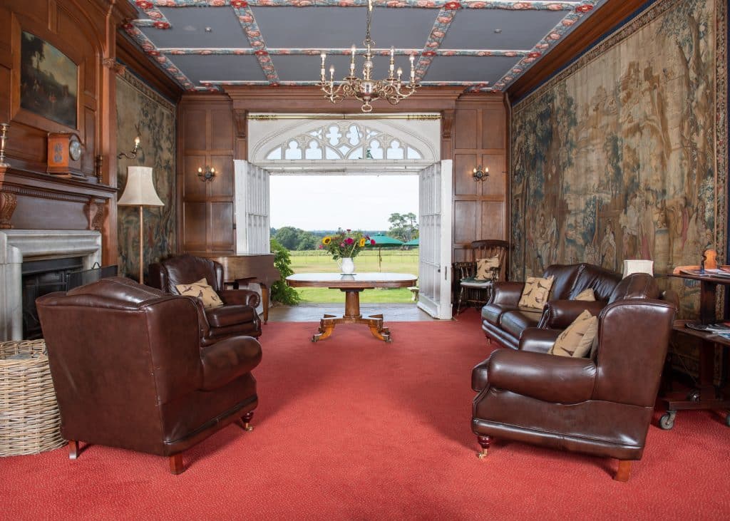 a living room filled with furniture and a fireplace