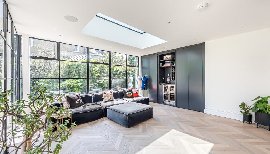a living room filled with furniture and a large window