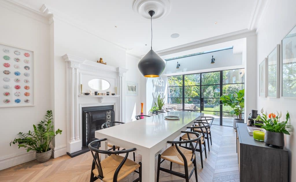 a dining room table in front of a window
