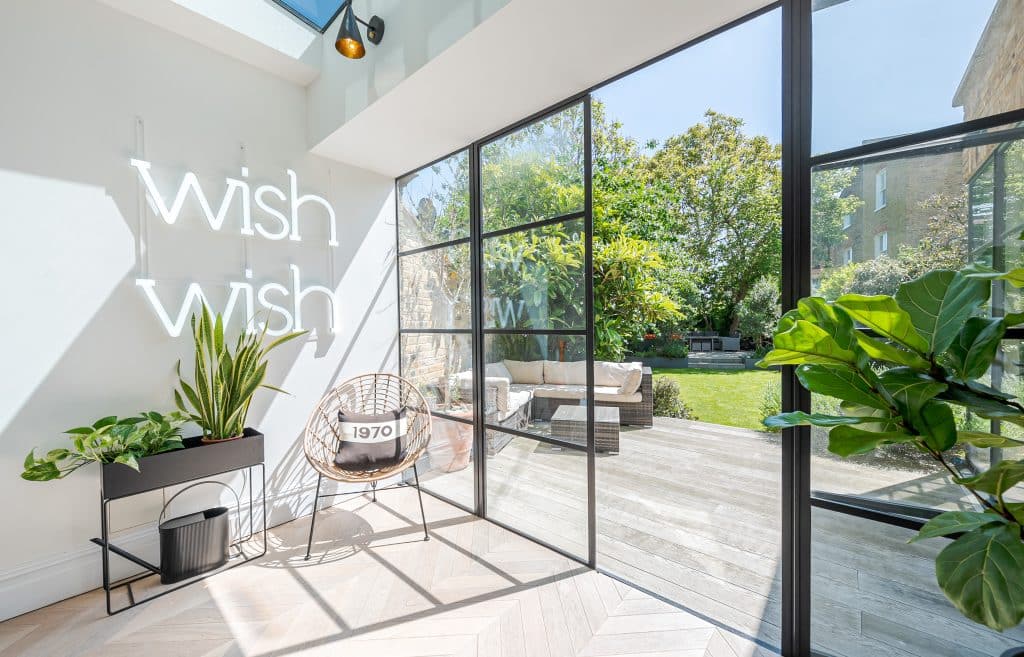 a room filled with furniture and a large window