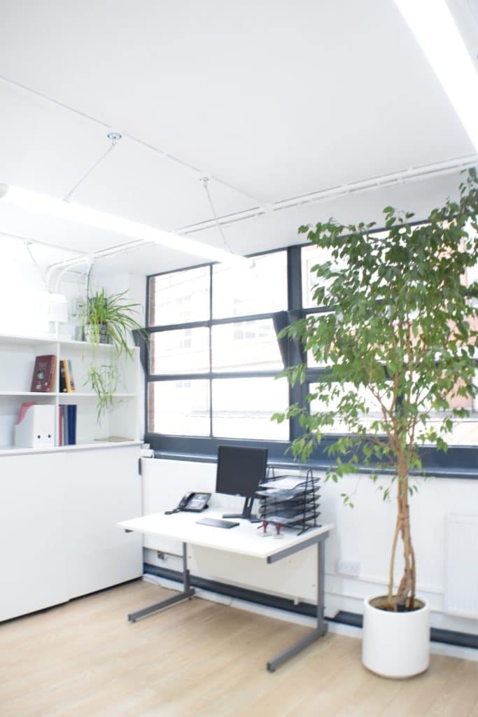 a room filled with furniture and a large window