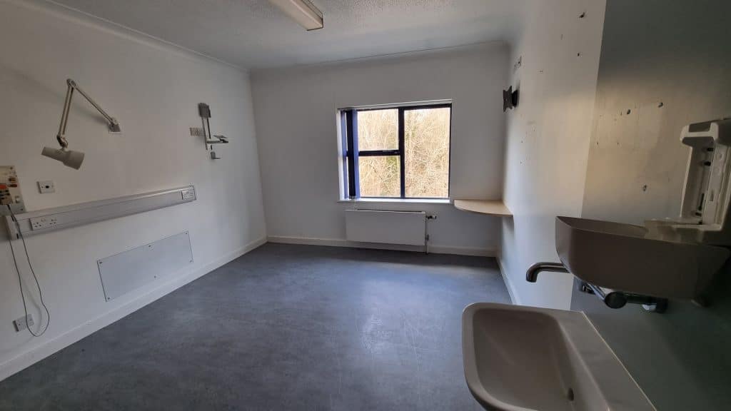 a room with a sink and a mirror