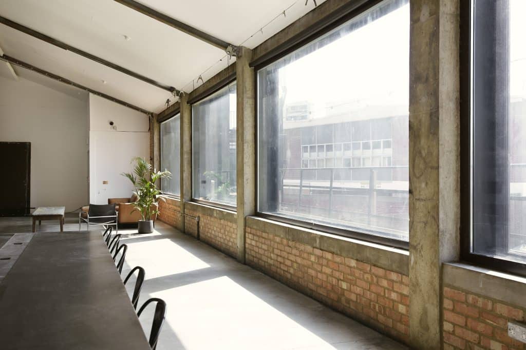 a room filled with furniture and a large window