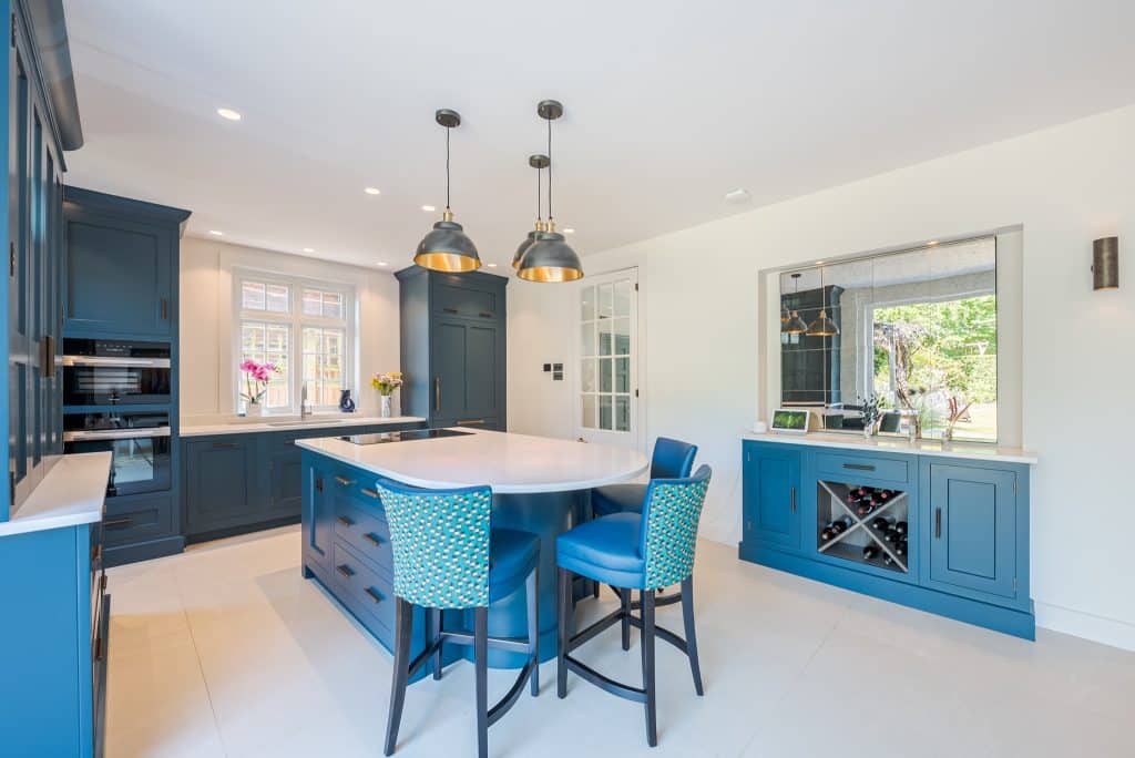 a kitchen with a blue chair