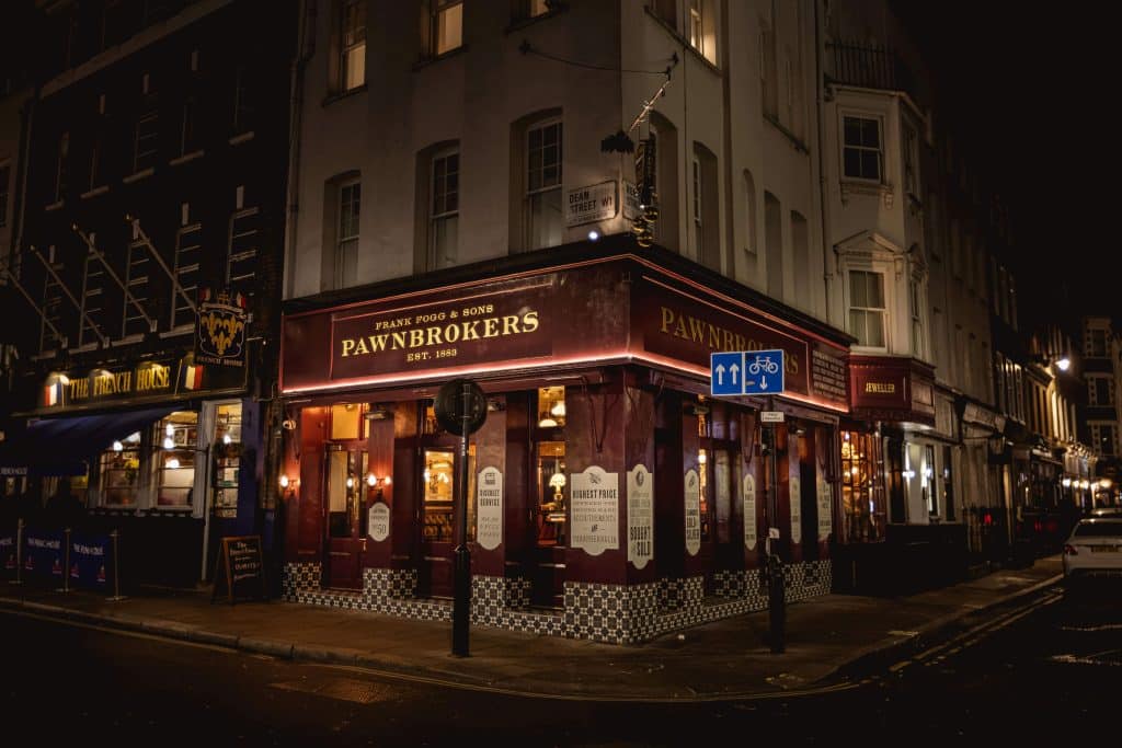 a lit up city street at night