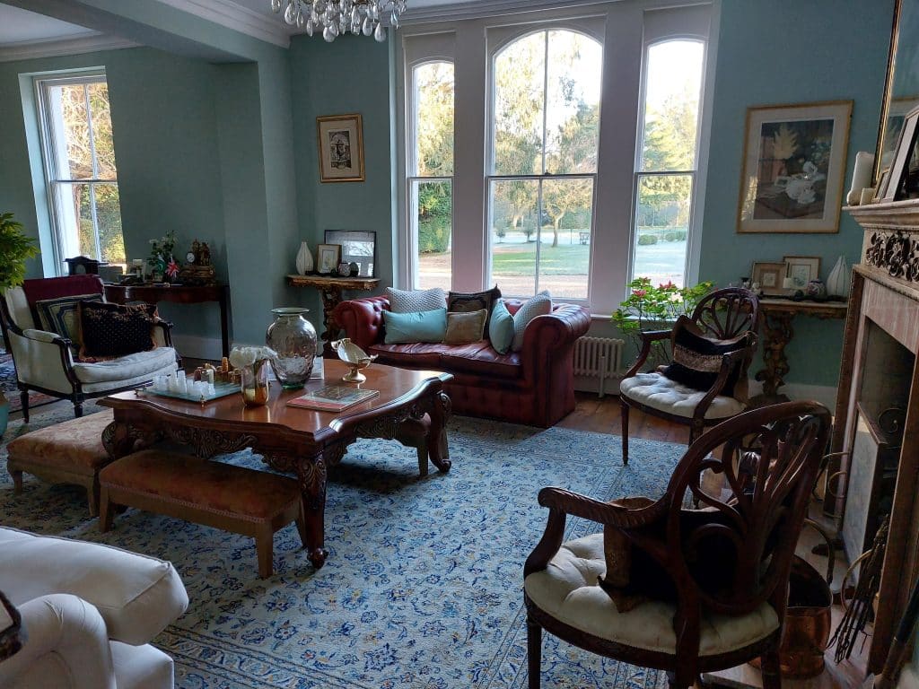 a living room filled with furniture and a fire place