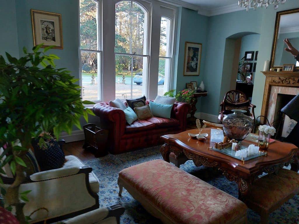 a living room filled with furniture and a large window