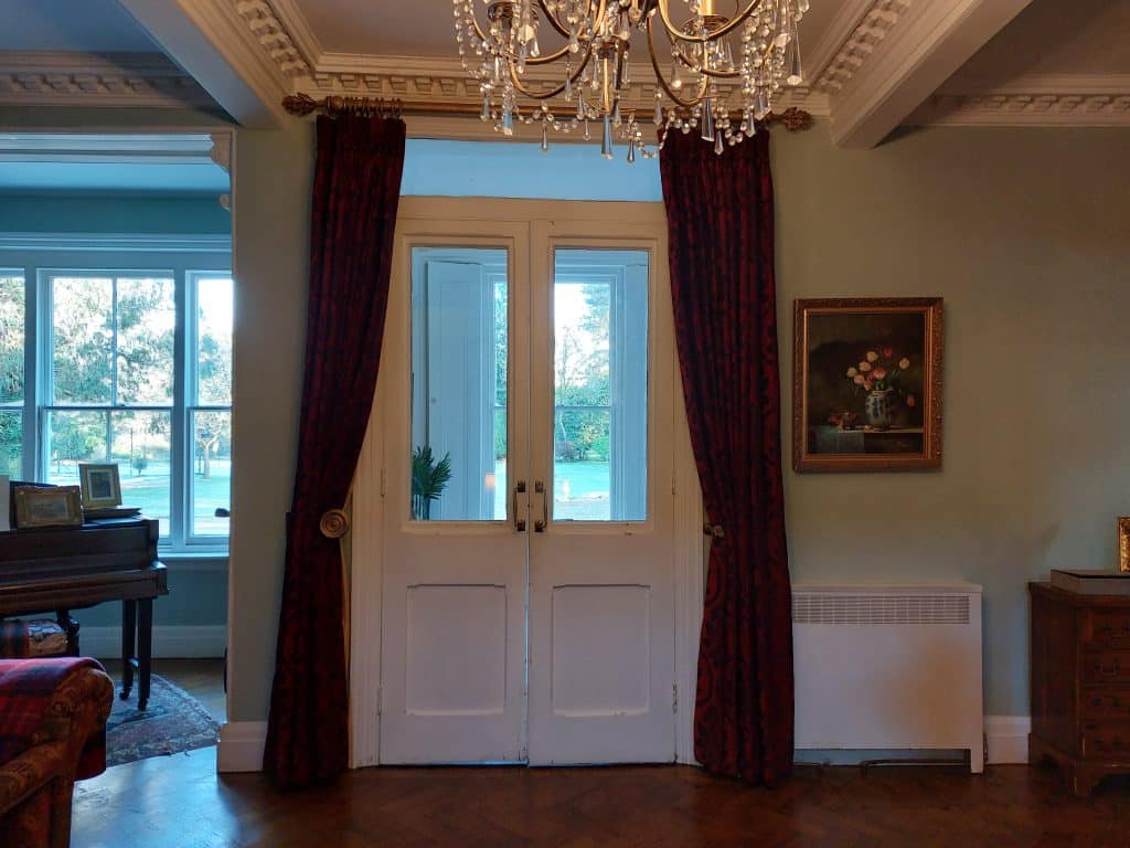 a room filled with furniture and a large window