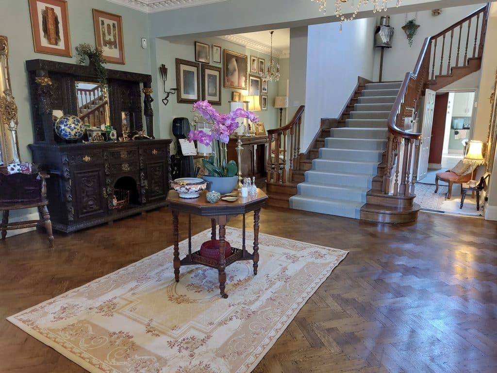 a living room filled with furniture and a fireplace