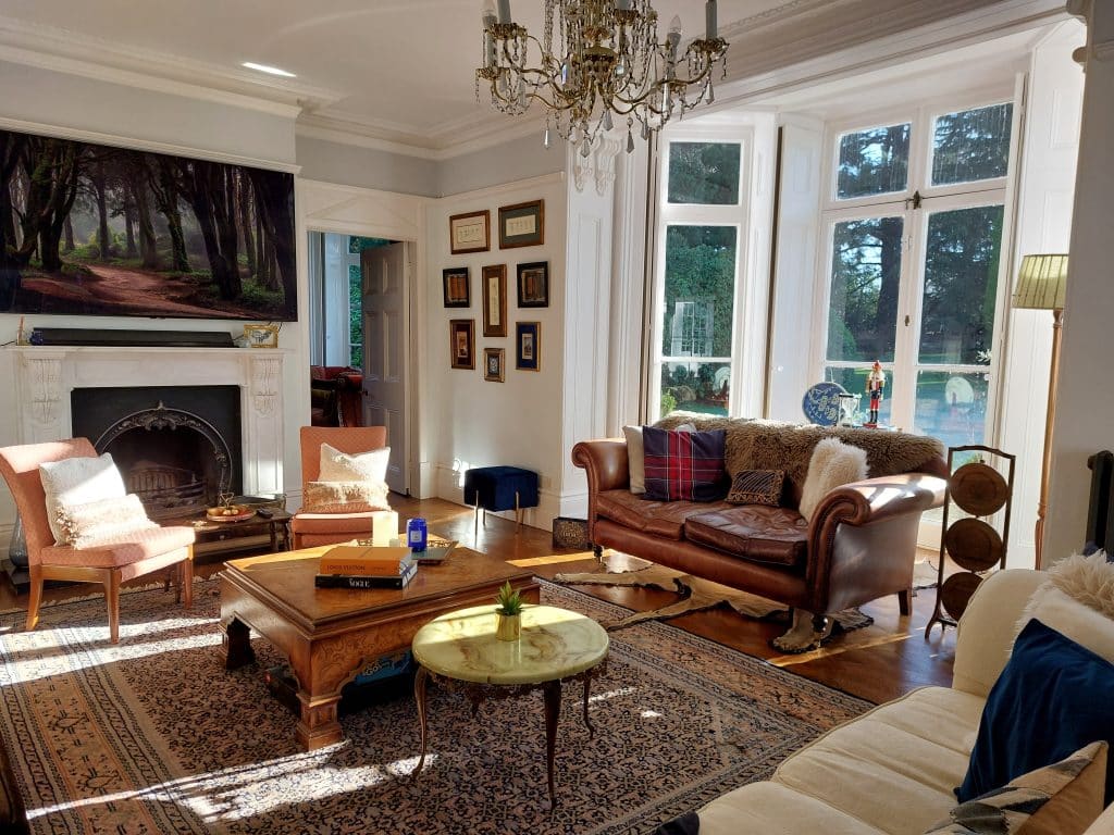 a living room filled with furniture and a fire place