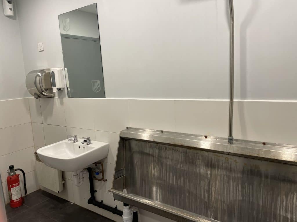 a restroom with a sink and a mirror