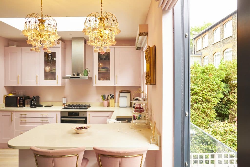 a kitchen with a sink and a mirror