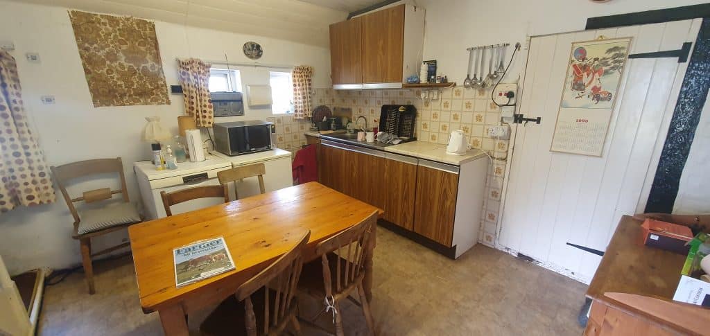 a kitchen with a dining room table